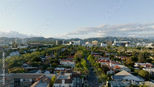 Aerial view of traffic and luxury homes in Beverly Hills, sunset in Los Angeles, USA