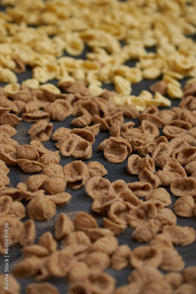 A closeup shot of a orecchiette pasta A closeup shot of a orecchiette pasta