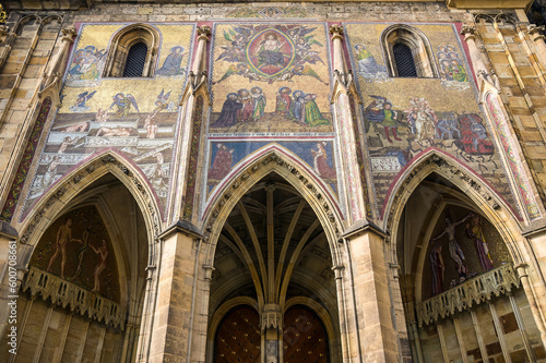 Exterior of the St. Vitus Cathedral in Prague. Gothic entrance door with mosaics and carvings.