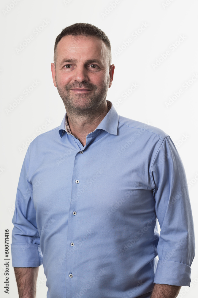 casual businessman wearing formal business clothes smiling at camera with crossed hands isolated over gray background. casual businessman wearing formal business clothes smiling at camera with crossed hands isolated over gray background.