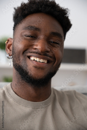 Portrait of black man looking and smiling at camera