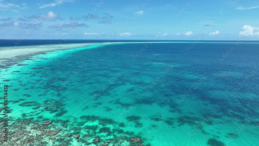 Ravishing Coral Reef Under Clear Blue Ocean In Tropical Paradise Island In The Philippines. aerial pullback Ravishing Coral Reef Under Clear Blue Ocean In Tropical Paradise Island In The Philippines. aerial pullback