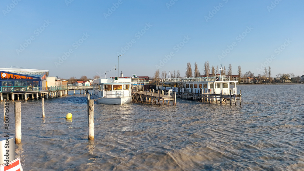 Neusiedl, Podersdorf am See, Burgenland, Austria - March 2023: View of the lighthouse, wooden pier