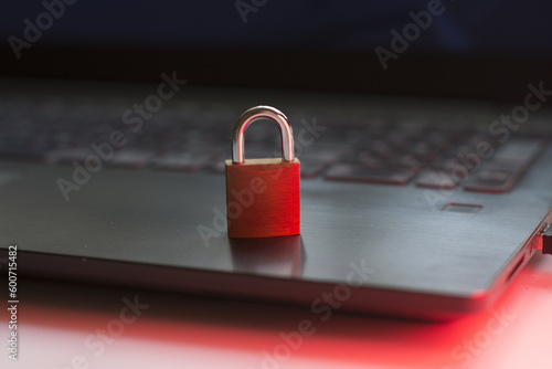 Closeup of closed metal padlock on modern laptop personal data protection Security concept