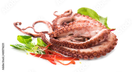 Octopus served with vegetables, sea food. Freshly boiled octopus isolated on white background, Mediterranean cuisine, dinner. 