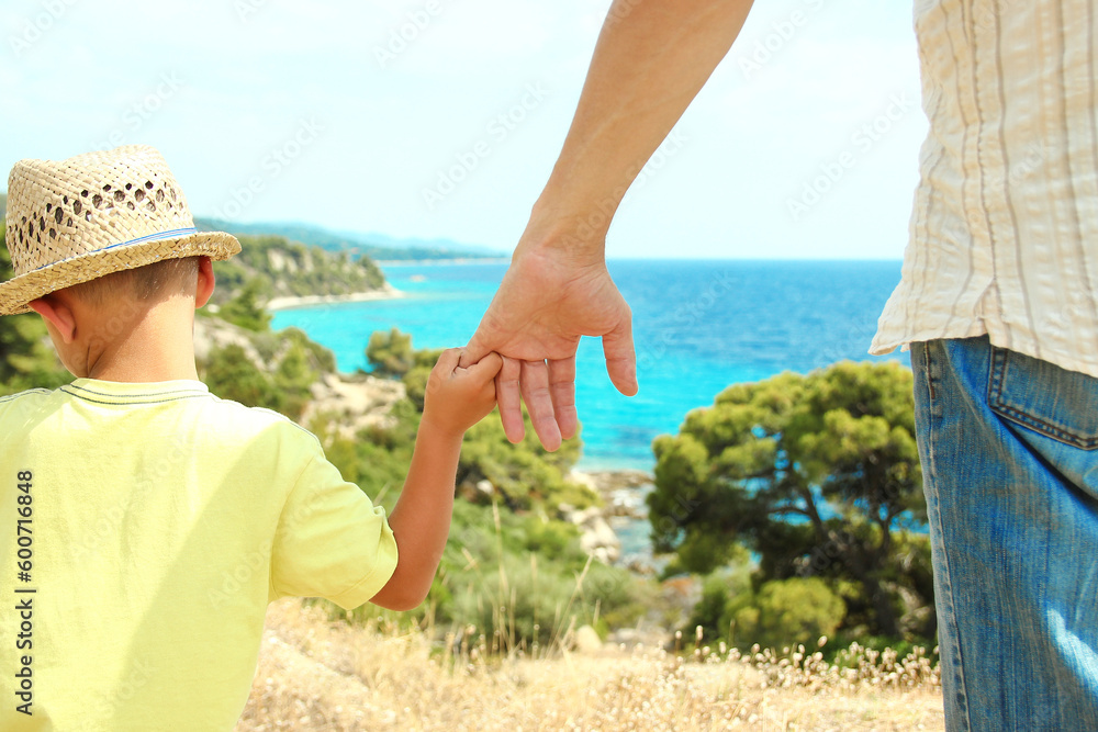 A hands of happy parents and children at sea in travel background in greece A hands of happy parents and children at sea in travel background in greece
