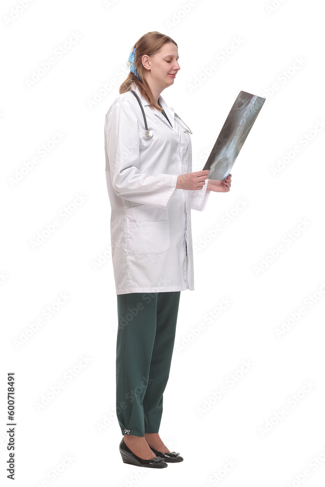 Front view of female doctor wearing stethoscope and glasses looking at an x-ray Front view of female doctor wearing stethoscope and glasses looking at an x-ray