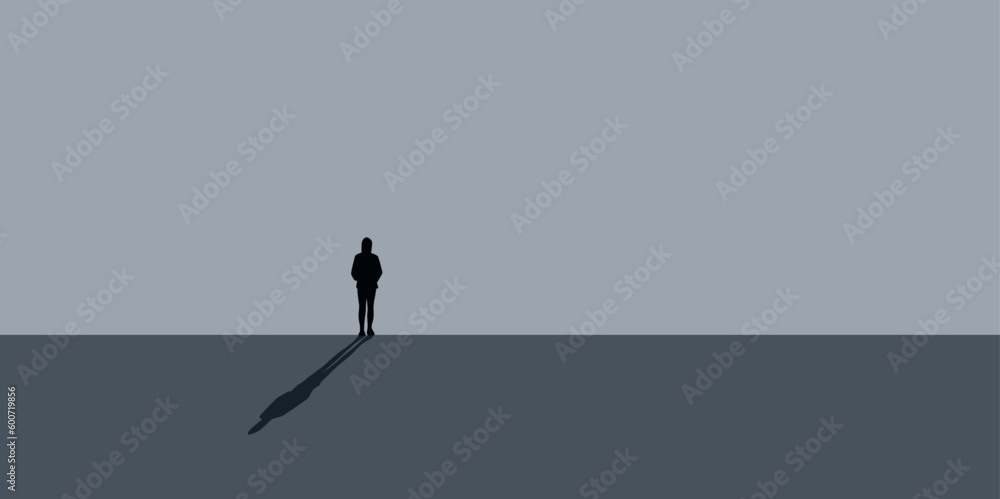 lonely sad girl stands in front of a gray wall - obrazy, fototapety, plakaty 