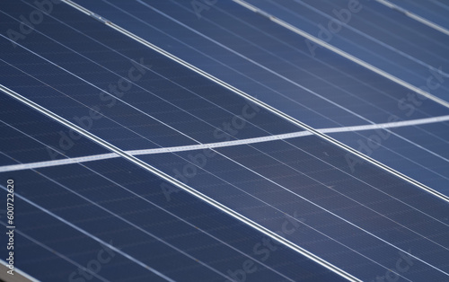 Wide angle selective focus concept photo with some big solar panels. Photovoltaic electrical energy industry, eco friendly way to produce electricity from sun.