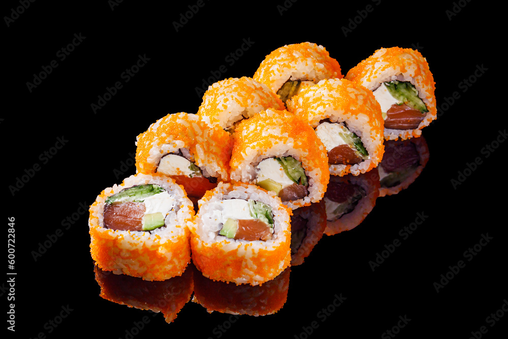 sushi roll with salmon cream cheese tobiko avocado and cucumber on a black mirror background sushi roll with salmon cream cheese tobiko avocado and cucumber on a black mirror background