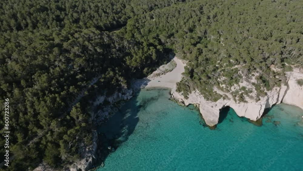 Forest on Menorca island with hidden white sand beach and perfectly clear blue waters in Spain. Forest on Menorca island with hidden white sand beach and perfectly clear blue waters in Spain.
