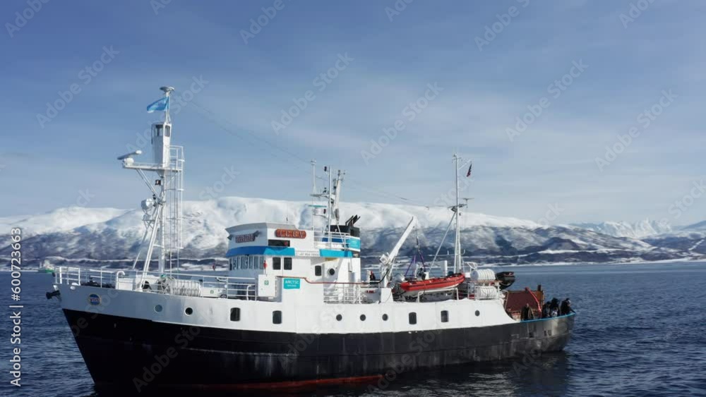 Aerial Drone view Polar Fjord Cruise Ship Sailing in the Arctic Sea in Tromso, Norway. Aerial Drone view Polar Fjord Cruise Ship Sailing in the Arctic Sea in Tromso, Norway.
