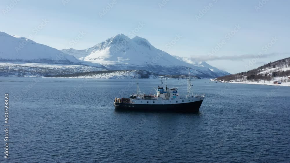 Aerial Drone view Polar Fjord Cruise Ship Sailing in the Arctic Sea in Tromso, Norway. Aerial Drone view Polar Fjord Cruise Ship Sailing in the Arctic Sea in Tromso, Norway.
