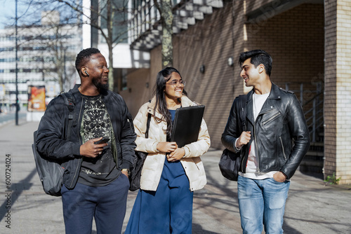 Student friends walking on campus photo