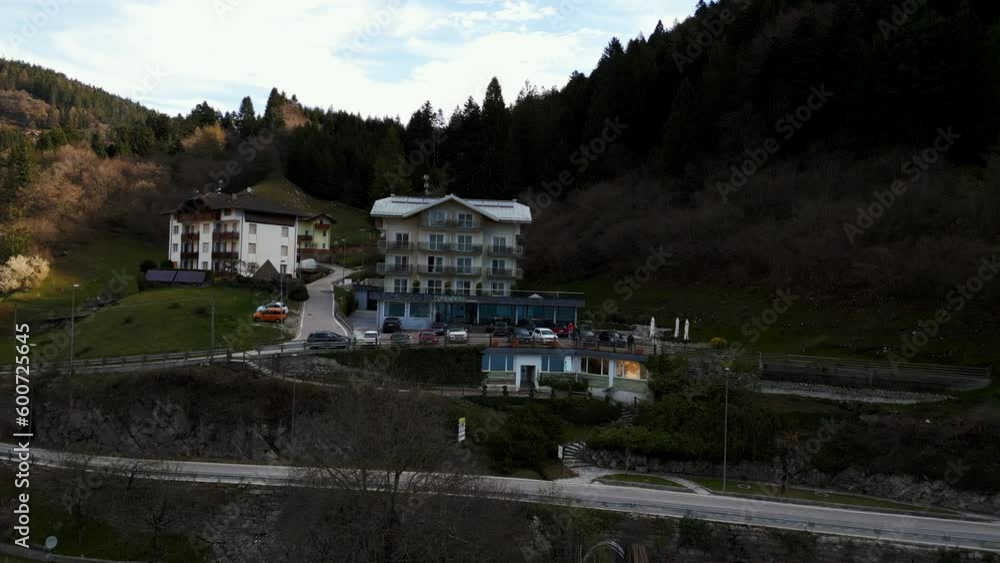 Hotels and tourist buildings in Molveno Lake. Aerial drone shot. Hotels and tourist buildings in Molveno Lake. Aerial drone shot.