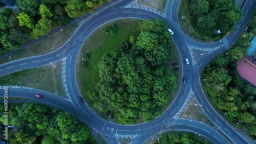 Aerial drone shot of a UK round about in High Wycombe, England. Cars driving. Camera rotates slowly clockwise. photo