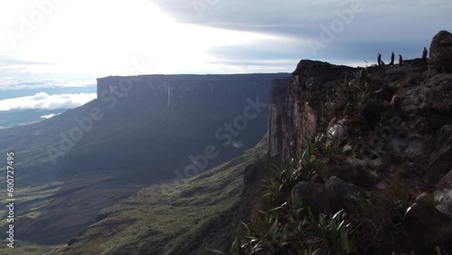Drone flying over the top of Tepui Roraima mountain in Venezuela with people visiting it photo