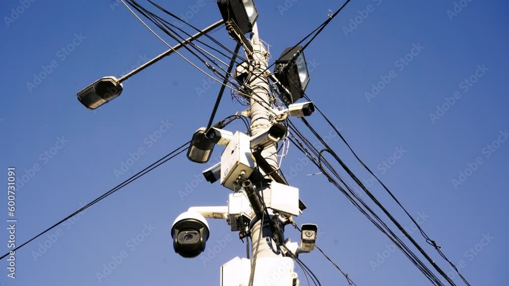 Many CCTV cameras are installed to ensure people's safety. Against the background of a bright sky. Concept of modern technologies, facial recognition, no privacy. Many CCTV cameras are installed to ensure people's safety. Against the background of a bright sky. Concept of modern technologies, facial recognition, no privacy.