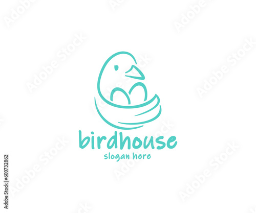Bird sitting on the nest with eggs logo design. The bird flaps its wing, which looks like a nest graphic design