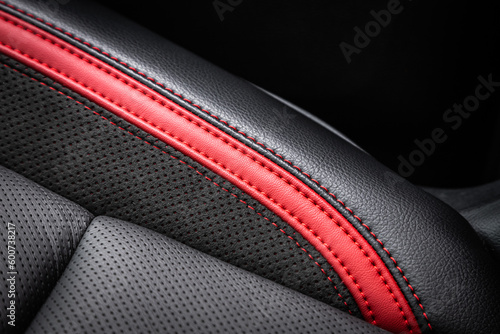 close-up black and red  perforated leather car seat. Skin texture