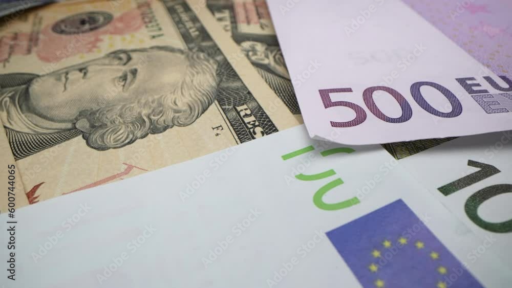 Hundred Euro cash macro view. 100 Euro Cash and American USA dollars on the table Eu Fiat Money. Financial Crisis. Investment Success. Money power concept. Hundred Euro cash macro view. 100 Euro Cash and American USA dollars on the table Eu Fiat Money. Financial Crisis. Investment Success. Money power concept.