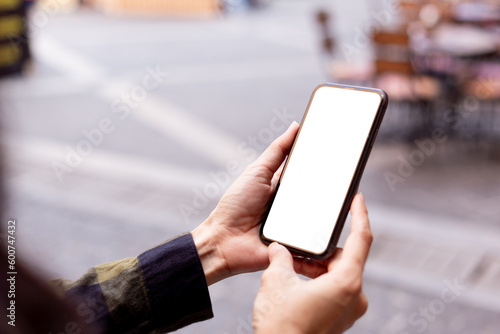 cell phone blank white screen mockup.hand holding texting using mobile on desk at office.background empty space for advertise.work people contact marketing business technology