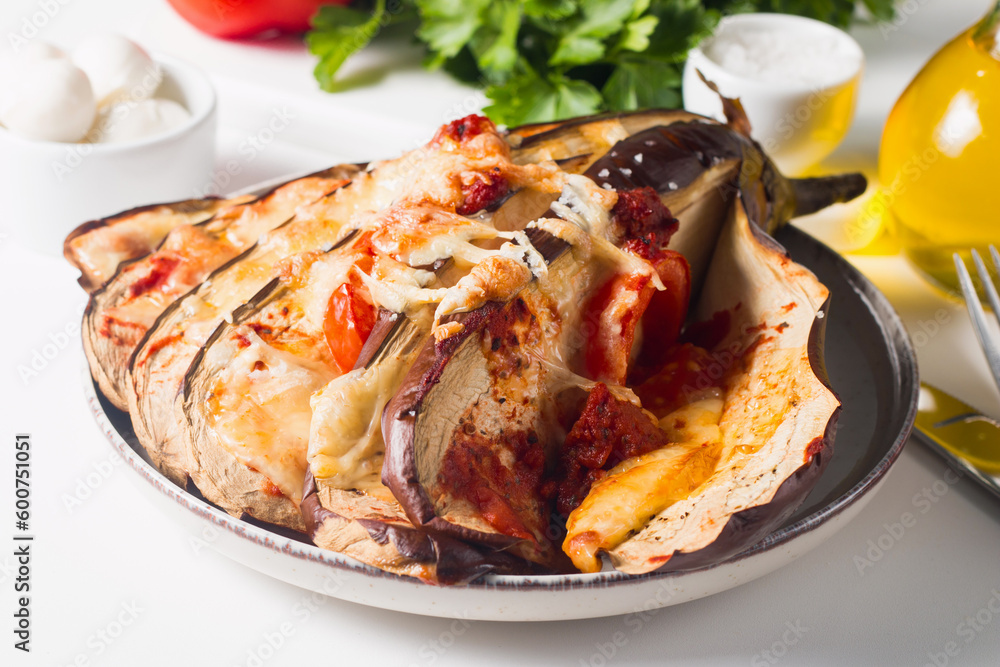 Baked cooked grilled eggplant with mozzarella cheese, tomatoes. Georgian cuisine. 