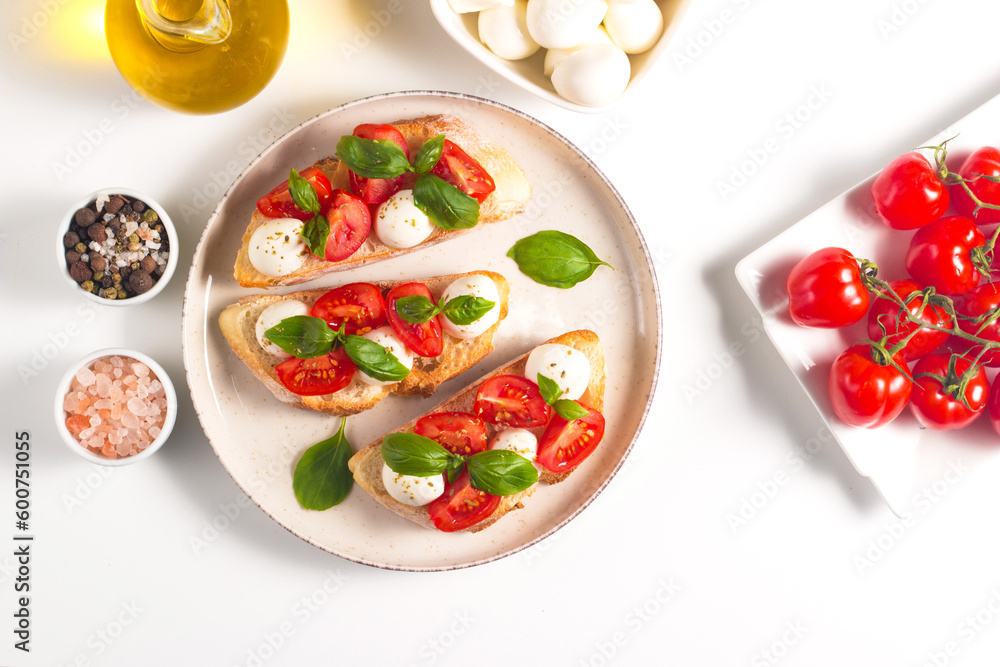Tomato, basil and mozzarella cheese fresh made caprese bruschetta. Italian tapas, antipasti with vegetables, herbs and oil on grilled ciabatta and baguette bread. Open sandwich. Tomato, basil and mozzarella cheese fresh made caprese bruschetta. Italian tapas, antipasti with vegetables, herbs and oil on grilled ciabatta and baguette bread. Open sandwich.