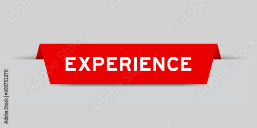 Red color inserted label with word experience on gray background
