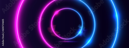 Glowing neon circle light on black background