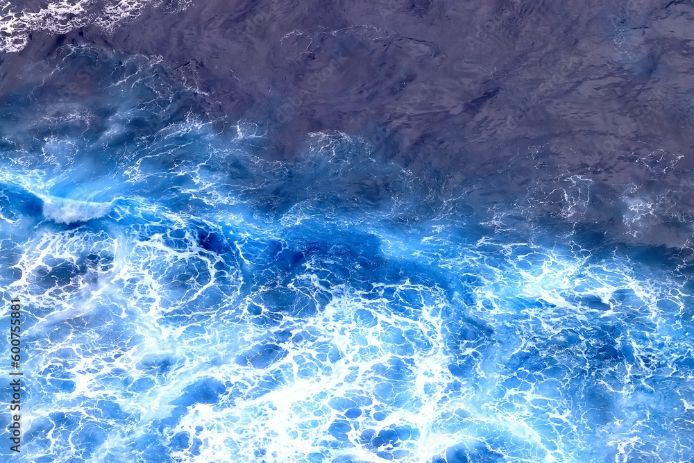 Obraz premium wave in the ocean abstract background, blue sea texture motion