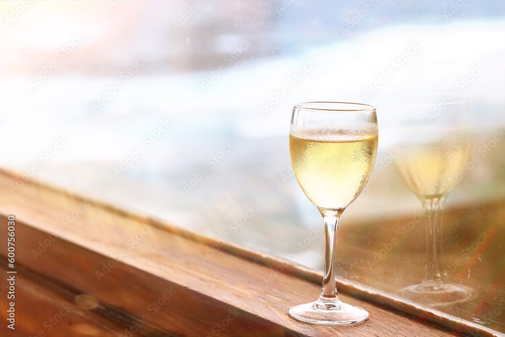 a glass of white wine in a restaurant, alcohol luxury background a glass of white wine in a restaurant, alcohol luxury background