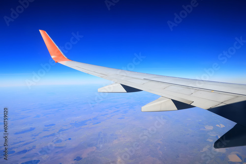 airplane wing sky view porthole