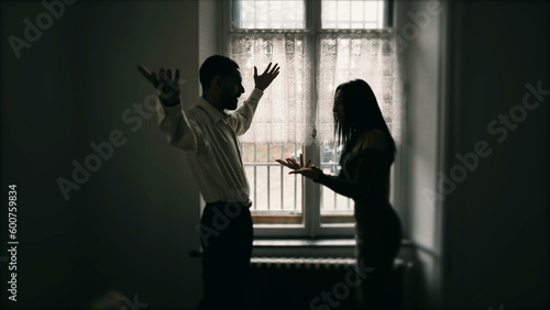 Фотография Silhouette of couple fighting each other, arguing and yelling at one another