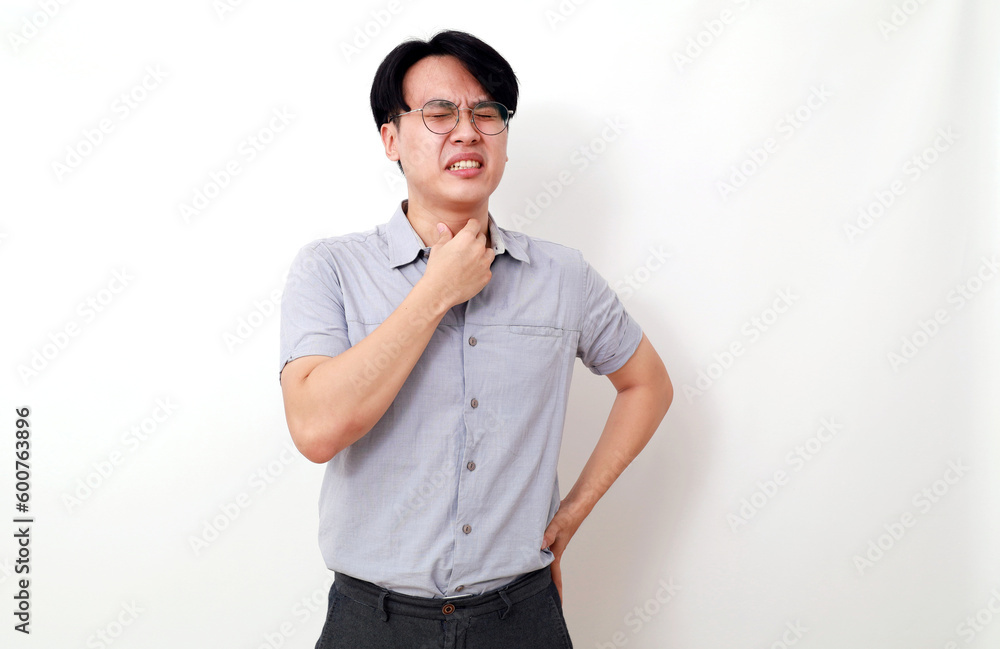 Sad sick young asian man with sore throat. Isolated on white background Sad sick young asian man with sore throat. Isolated on white background