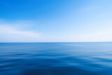 Blue sea with waves and sky with clouds.Calm tranquil blue sea relaxing background motion blurred