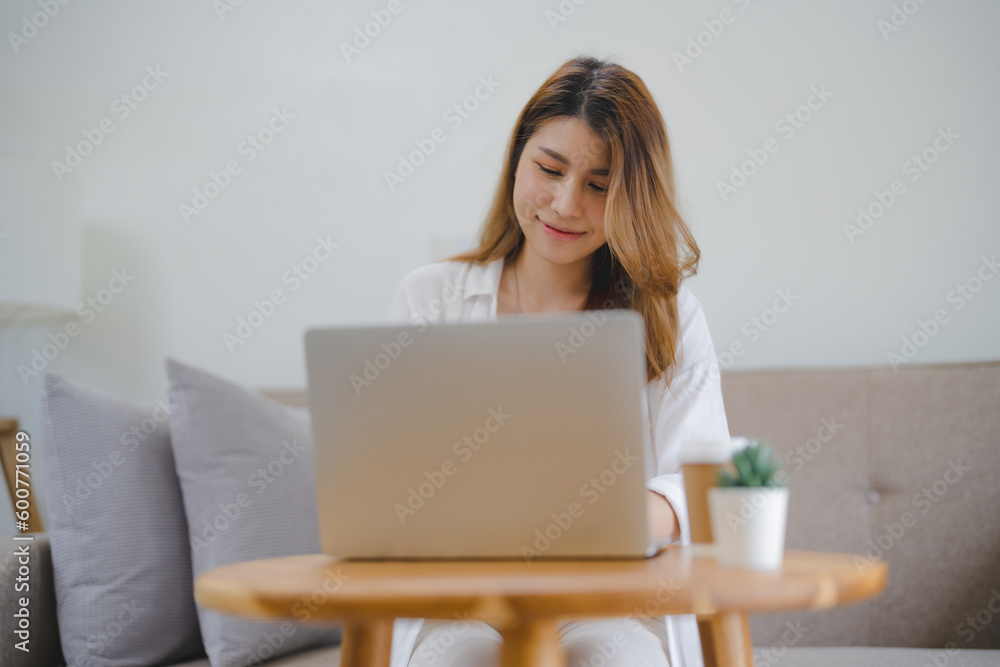 Happy asian woman using laptop and credit card for online payment, E-commerce Happy asian woman using laptop and credit card for online payment, E-commerce