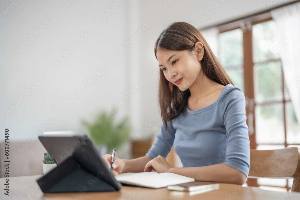 Happy Confident young asian businesswoman working with tablet Start up small business owner. business successful technology concept Happy Confident young asian businesswoman working with tablet Start up small business owner. business successful technology concept