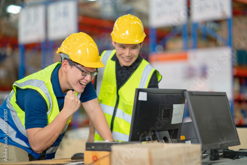 A male manager is checking inventory inside a warehouse.