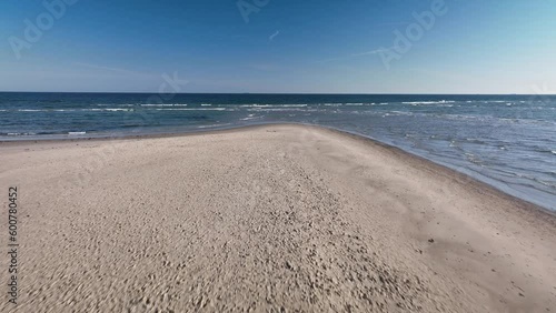 Aerial footage of tip of Skagens Gren (the northermost tip of the Jutland penisula) where the Baltic Sea and the North Sea meet. Point where the Kattegat and Skagerrak Seas meet, creating waves. photo