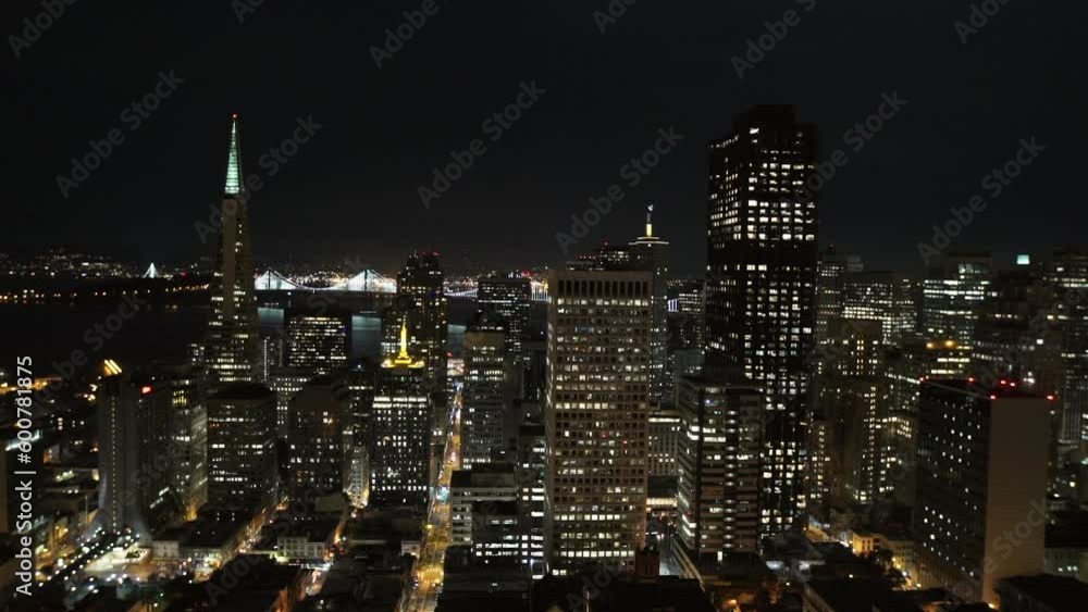 Aerial Lockdown Shot Of Illuminated Skyscrapers In City Against Sky At Night - San Francisco, California Aerial Lockdown Shot Of Illuminated Skyscrapers In City Against Sky At Night - San Francisco, California