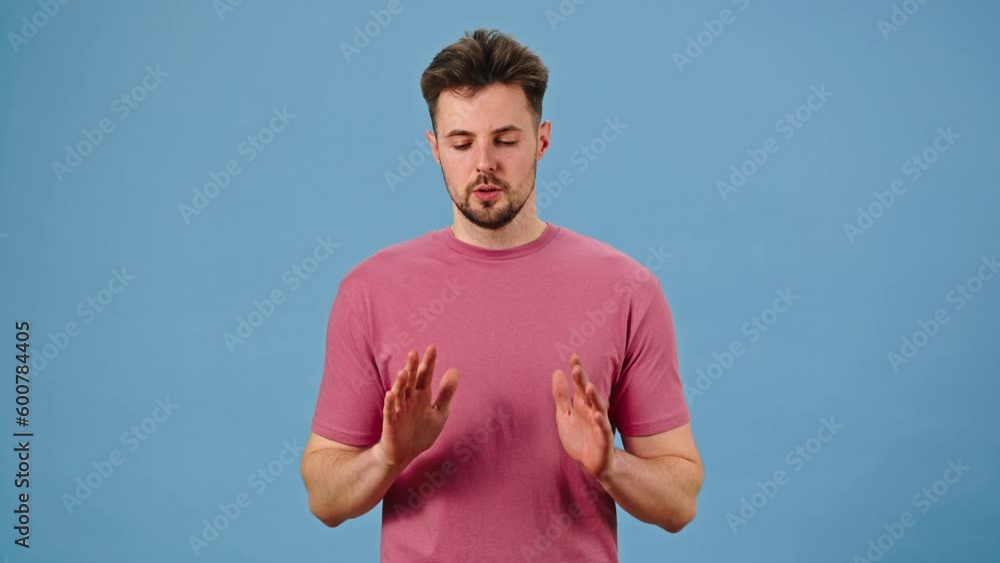 Nervous man tries to calm down breathing slowly and deeply Nervous man tries to calm down breathing slowly and deeply