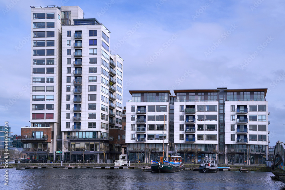 Row of modern apartment buildings in the Docklands area of Dublin along the Grand Canal Row of modern apartment buildings in the Docklands area of Dublin along the Grand Canal