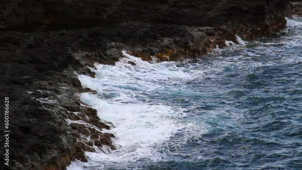 Lockdown Shot Of Waves Splashing On Rocky Coastline In Sea - Kauai, Hawaii Lockdown Shot Of Waves Splashing On Rocky Coastline In Sea - Kauai, Hawaii