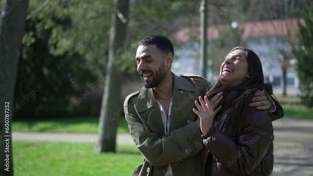 Happy Arab Couple Enjoying Sunny Stroll at Park with Genuine Laughter and Smiles Happy Arab Couple Enjoying Sunny Stroll at Park with Genuine Laughter and Smiles