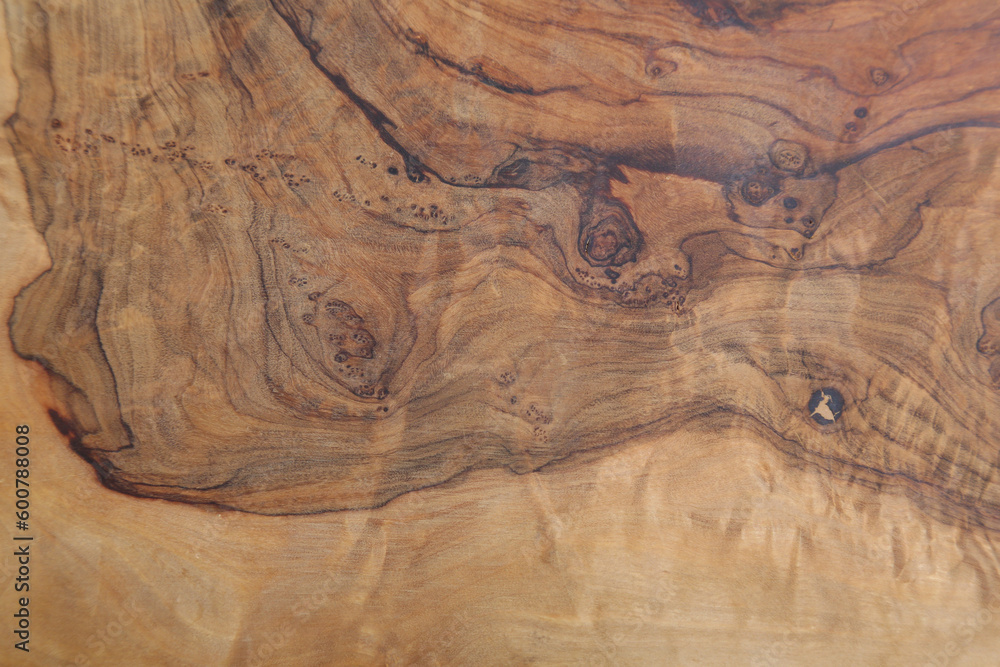 Naklejka premium wood texture background (olive wooden cutting board) tree, rings, lines, curves