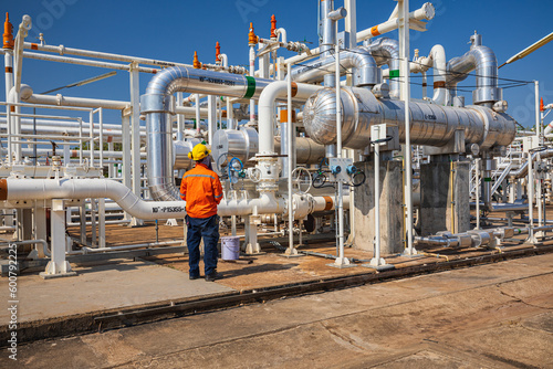 Male worker inspection at the exchanger of tank oil refinery pipeline plant steam vessel and column tank oil of Petrochemistry