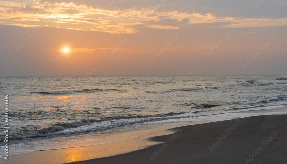 sunset over sea and waves on the beach sunset over sea and waves on the beach