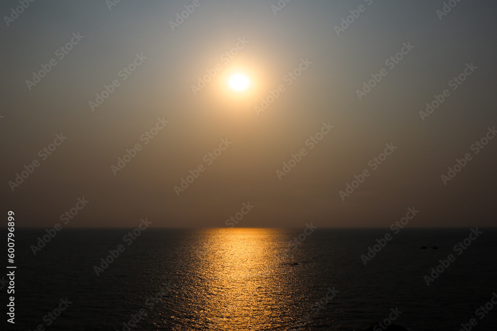 the nature image of sun rise in the horizon of a sea