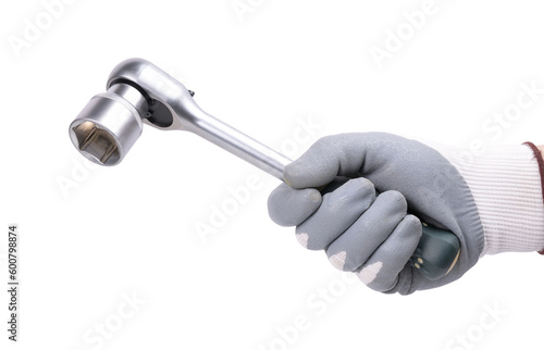 A hand in a protective glove holds a ratchet wrench (socket) on a white background. photo